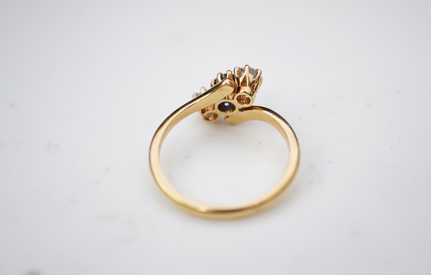 A sapphire and diamond three-stone ring, early 20th century